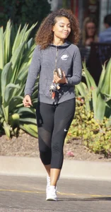 Beautiful black girl in Nike leggings in the parking lot