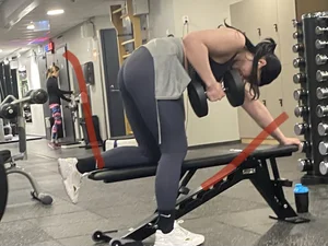 Sexy Lady in Grey Leggings Lifting a Dumbbell Bent Over Creepshots