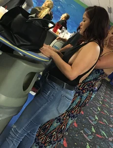 Thick brunette in tight jeans and showing some side boob