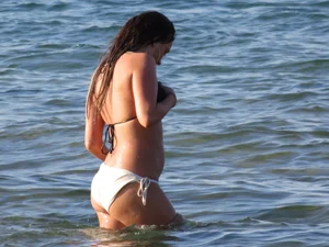 Sexy girl standing in water at the beach
