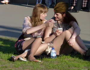 Girls Sitting on the Lawn in Skirts City Candid