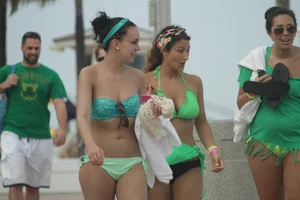 Saint Patrick's Day girls in bikinis at Deerfield Beach in Florida