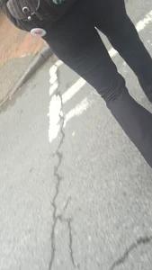 Girl with a nice ass in leggings walking down the street