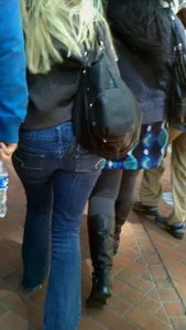 Blonde in tight jeans with her red thong sticking out