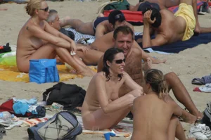 Topless girls on a beach in Barcelona