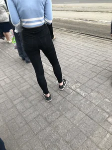 Skinny Girl in Tight Black Jeans on the Bus Stop Candid Photos