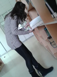 A Skinny Candid Girl in a Sweater And Leggings, Creepshot in a Public Library