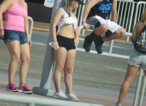 Couple of babes standing around in shorts