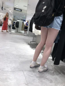 Hot Girl with Pale Skin in a Store Wearing Blue Denim Shorts Creepshots
