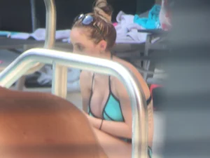 Hot girl at the pool in her bikini with big tits