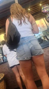 Short shorts on hot milf buying coffee