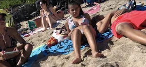 Beautiful brunette teen babe on the beach with a perfect body