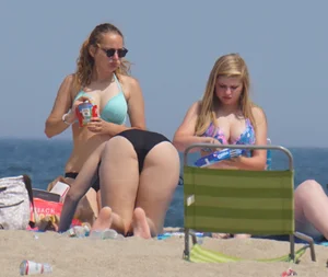 3 girls on the beach in bikinis with big boobs, one brunette and two blondes