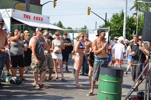 Hot ass Canadian babe in a bikini dancing at a concert