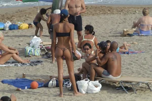Topless girls on a beach in Barcelona