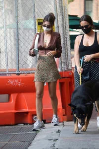 Emily Ratajkowski in mini skirt out for a walk with a friend in New York