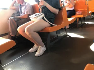 Amazing Hot Girl Sitting in the Train in Shorts Showing Off Her Gorgeous Legs Candid Gallery