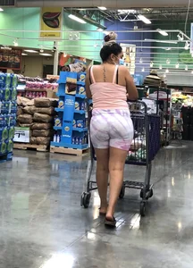 Thick Latina babe with a nice ass in tight patterned shorts