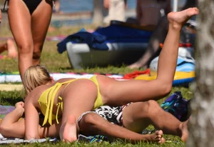 Blonde looking sexy in a yellow bikin