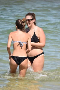 Sexy group of girls on the beach in various sizes