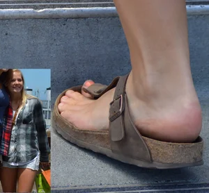 Foot in a Sandal Closeup of a Nice Girl