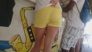 Milf in yellow shorts with vpl and a wedgie
