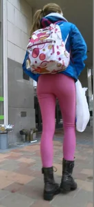 Skinny Girl With a Backpack in Pink Tight Pants Low Angle Photos