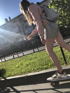 Girl in Denim Shorts on Skateboard Street Candid Photos
