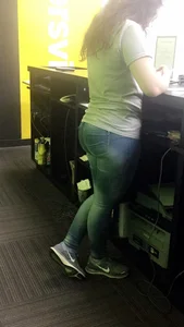 Chubby Shop Assistant in Tight Jeans Standing By the Counter