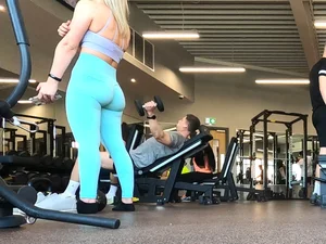 Gym blonde in turquoise leggings notices me and doesn’t mind, even moves in front of me later for some close-ups