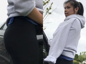 Cute girl in leggings getting into the car street photos