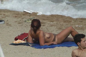 Topless girls on a beach in Barcelona
