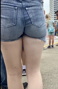 Tight ass in grey jean shorts.