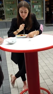 Girl in Sandals Eating in a Street Cafe, Nice Feet