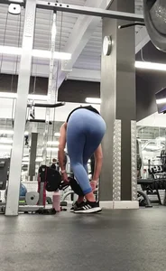 Bending gym babe stern face