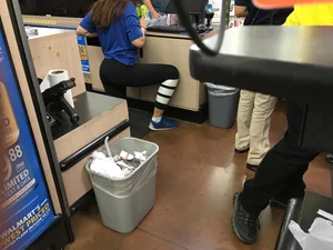 Hot Skinny Girl in Yoga Pants Standing on One Knee at the Store Creepshot