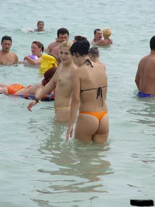 Beach voyeur girls in bikinis, thongs and topless