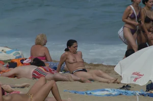 Topless girls on a beach in Barcelona