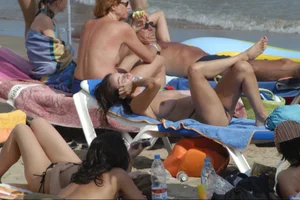 Girls on a nude beach in Sitges, Spain