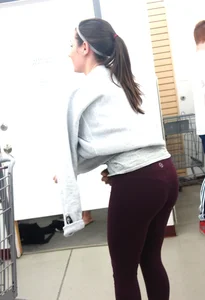 Short and cute brunette changing her shirt while in lulu's with vtl