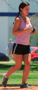 Hot brunette running in short shorts with vpl