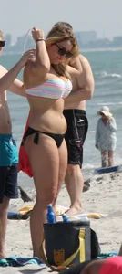 Big boobed thick blonde on the beach in a bikini