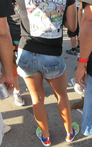 Brunette babe standing around in denim shorts