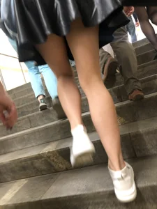 Awesome Candid Girl in a Leather Skirt And Sneakers Walking Down a Street, Then Flashing Her White Panties on the Stairs Creepshots Gallery
