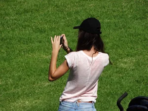 Skinny milf in tight jeans showing a bit of ass crack