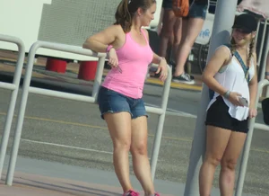 Couple of babes standing around in shorts
