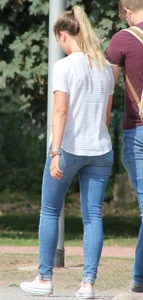 Blonde chick walking with her boyfriend in tight jeans