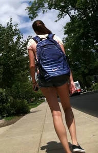 Hot college girl in little jean shorts showing some cheeks and legs