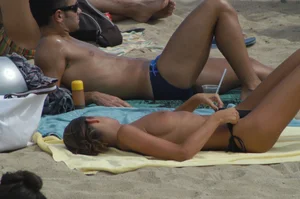 Topless girls on a beach in Barcelona