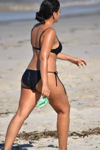 Thick mature brunette bikini lady on the beach with a nice body